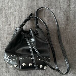 Black bucket bag with silver detail.